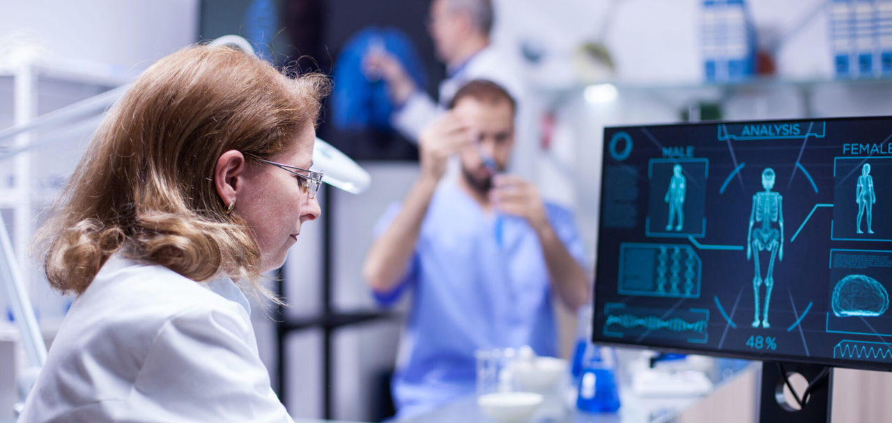 Woman working with computer in the office of a science laboratory Embedded